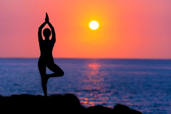 Namaste Silhouette of Woman in Yoga Pose at Beach